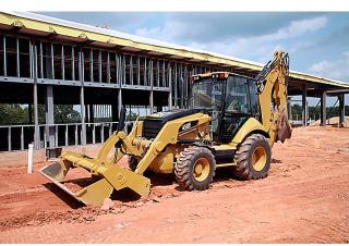 Екскаватор-навантажувач Caterpillar 450F