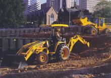 Екскаватор-навантажувач John Deere Construction 110