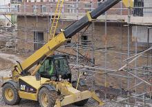 Телескопічні навантажувачі Caterpillar TH 63